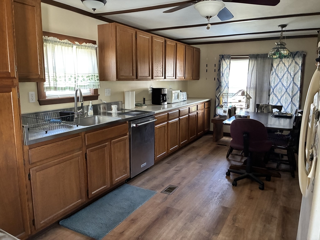 559 Tea Street, Unit 1 Charlemont, MA 01339 - Photo 4 of 14 a kitchen with sink cabinets and window