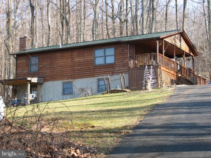218 Long View Road Linden, VA 22642 - Photo 1 of 16 a front view of a house with a yard