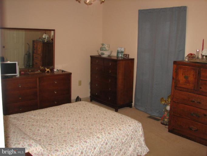 218 Long View Road Linden, VA 22642 - Photo 15 of 16 a bedroom with a bed and a dresser