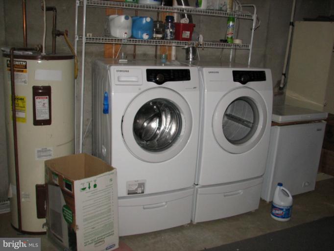 218 Long View Road Linden, VA 22642 - Photo 10 of 16 a kitchen with cabinets dryer and washer