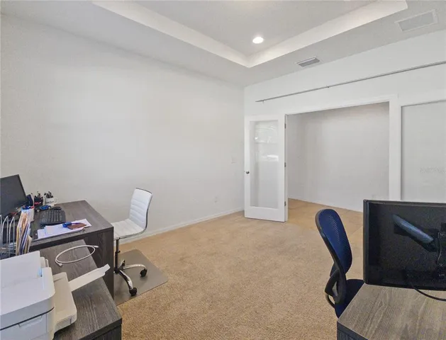 a view of workspace with lounge chair