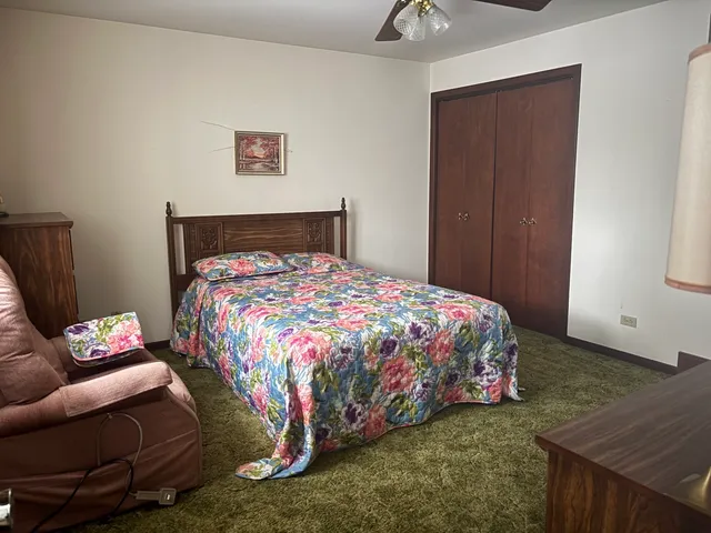 a bedroom with a bed and a couch