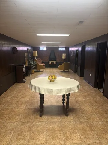 a kitchen with a table and chairs