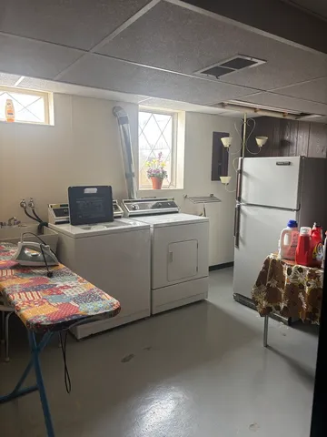 a kitchen with a sink cabinets and window