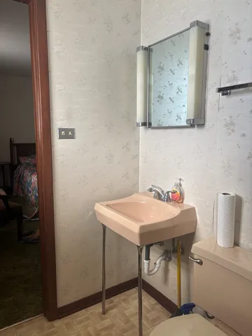 a dining room with a table and chairs