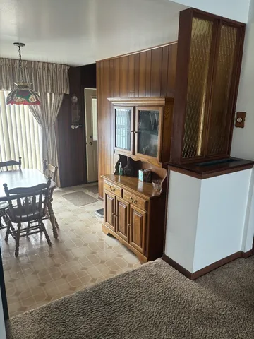 a view of kitchen with furniture and window
