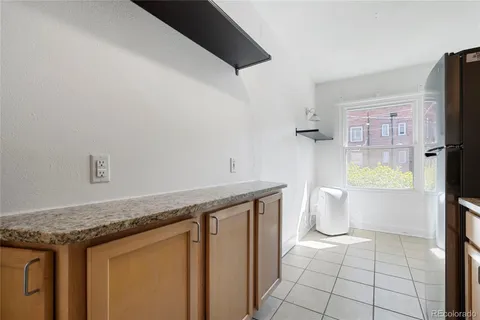a view of a bathroom with a granite countertop sink and a mirror