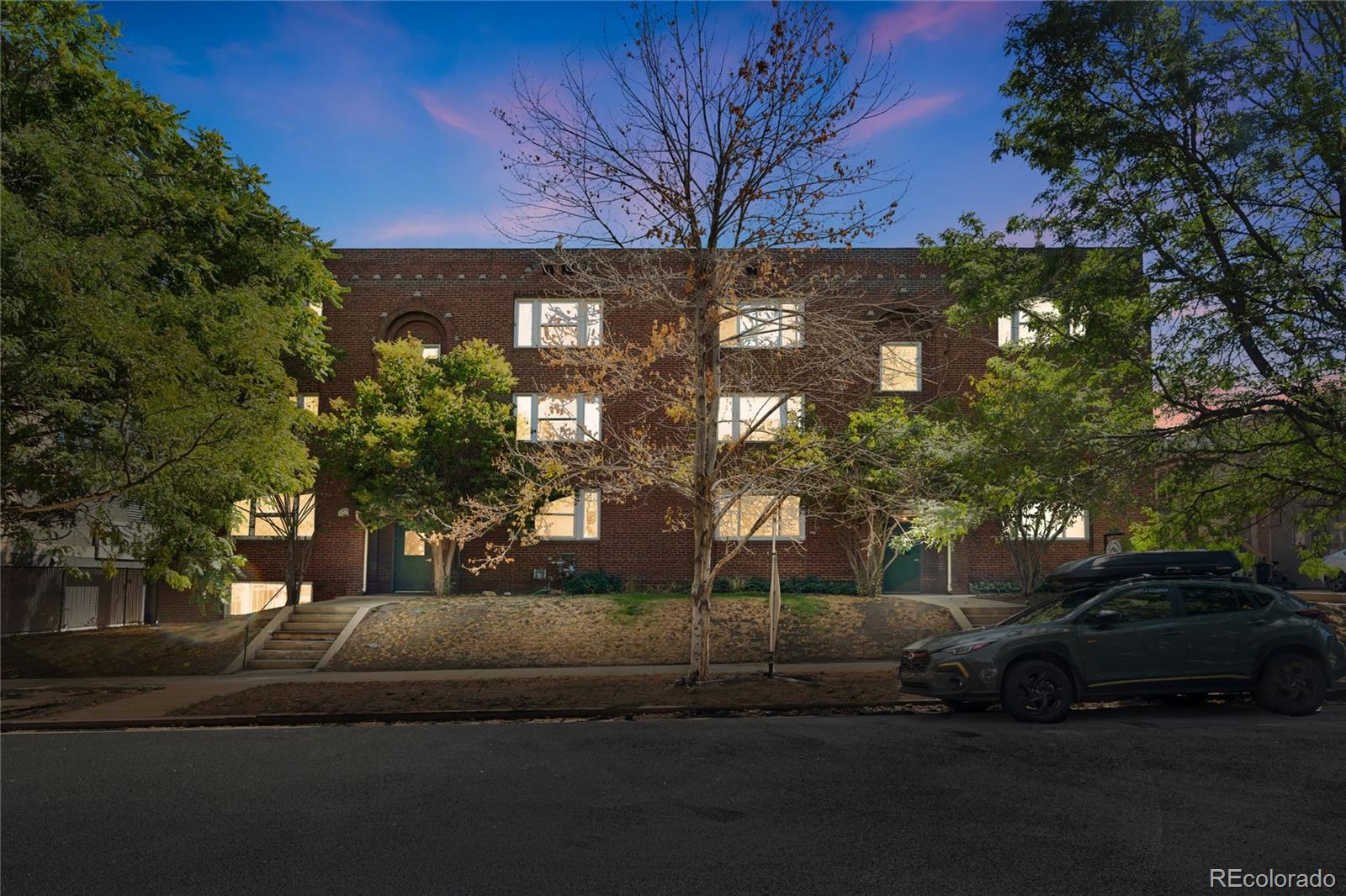 1416 North Downing Street, Unit 2 Denver, CO 80218 - Photo 2 of 12 a view of a car parked in front of a house