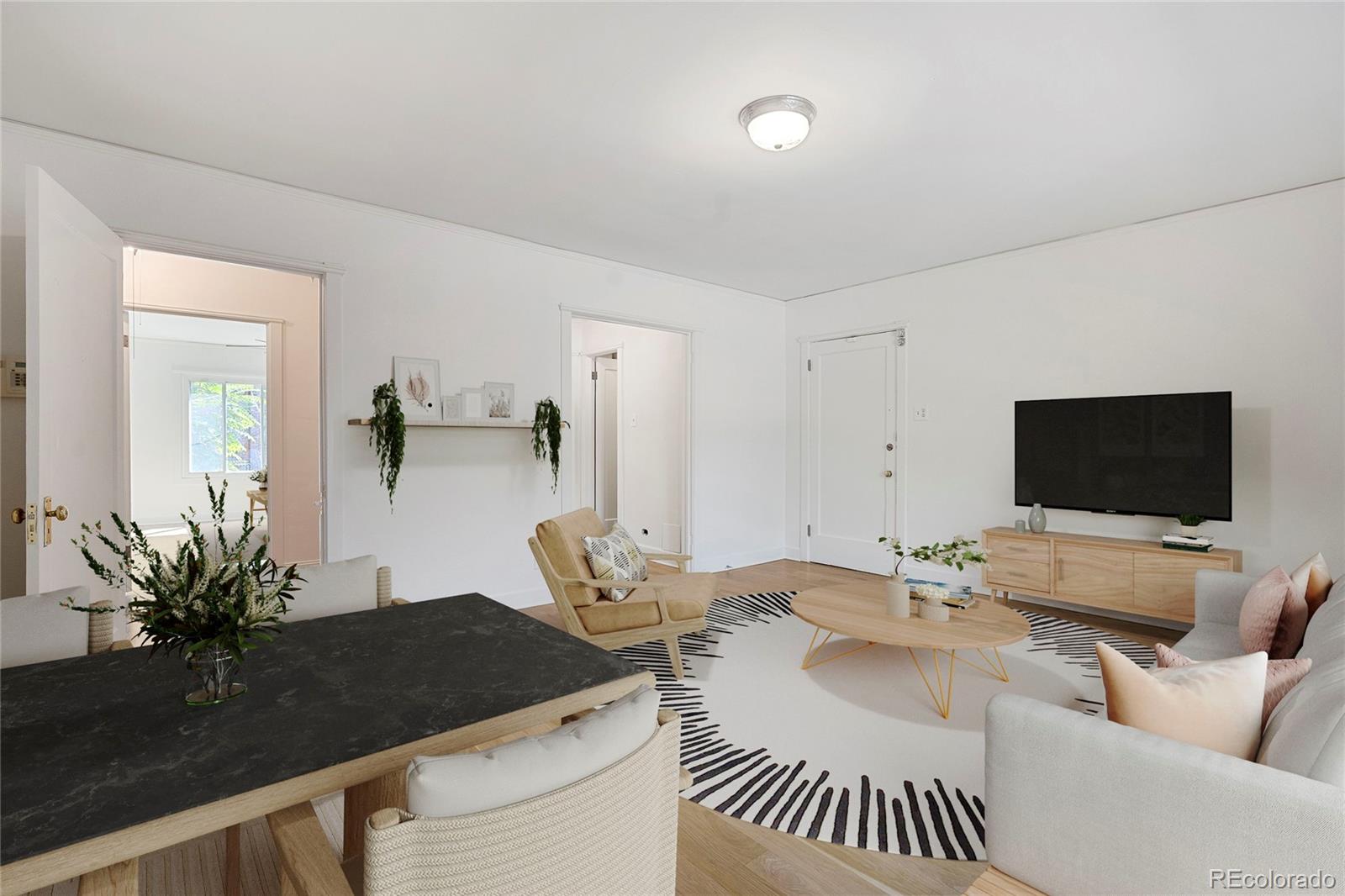 1416 North Downing Street, Unit 2 Denver, CO 80218 - Photo 5 of 12 a living room with furniture and a flat screen tv