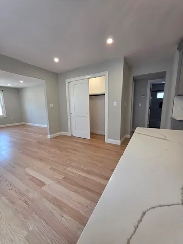 a view of a livingroom with wooden floor