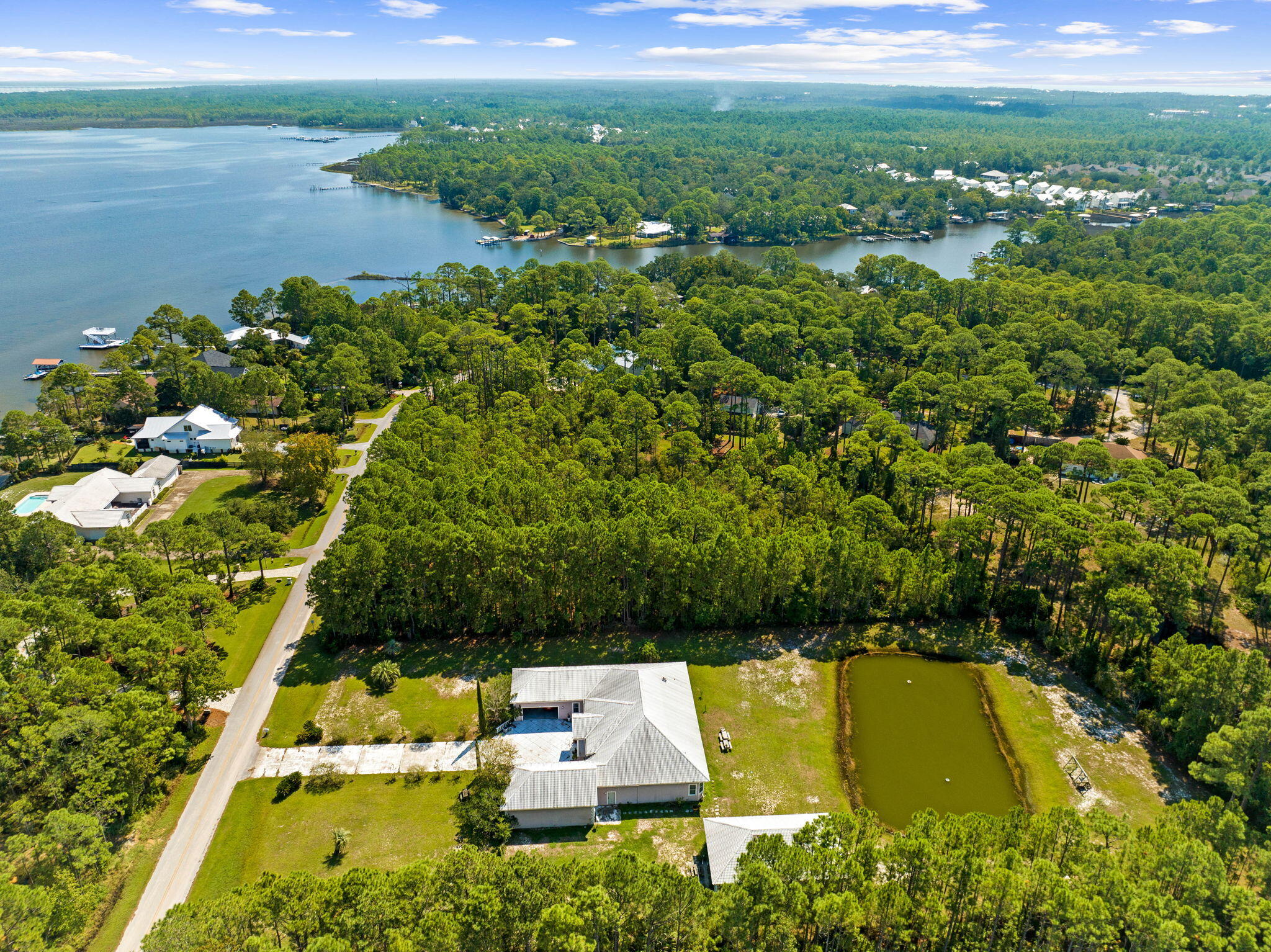 Lot 30 Woodland Bayou Drive Santa Rosa Beach, FL 32459 - Photo 20 of 28 a view of a lake with a houses