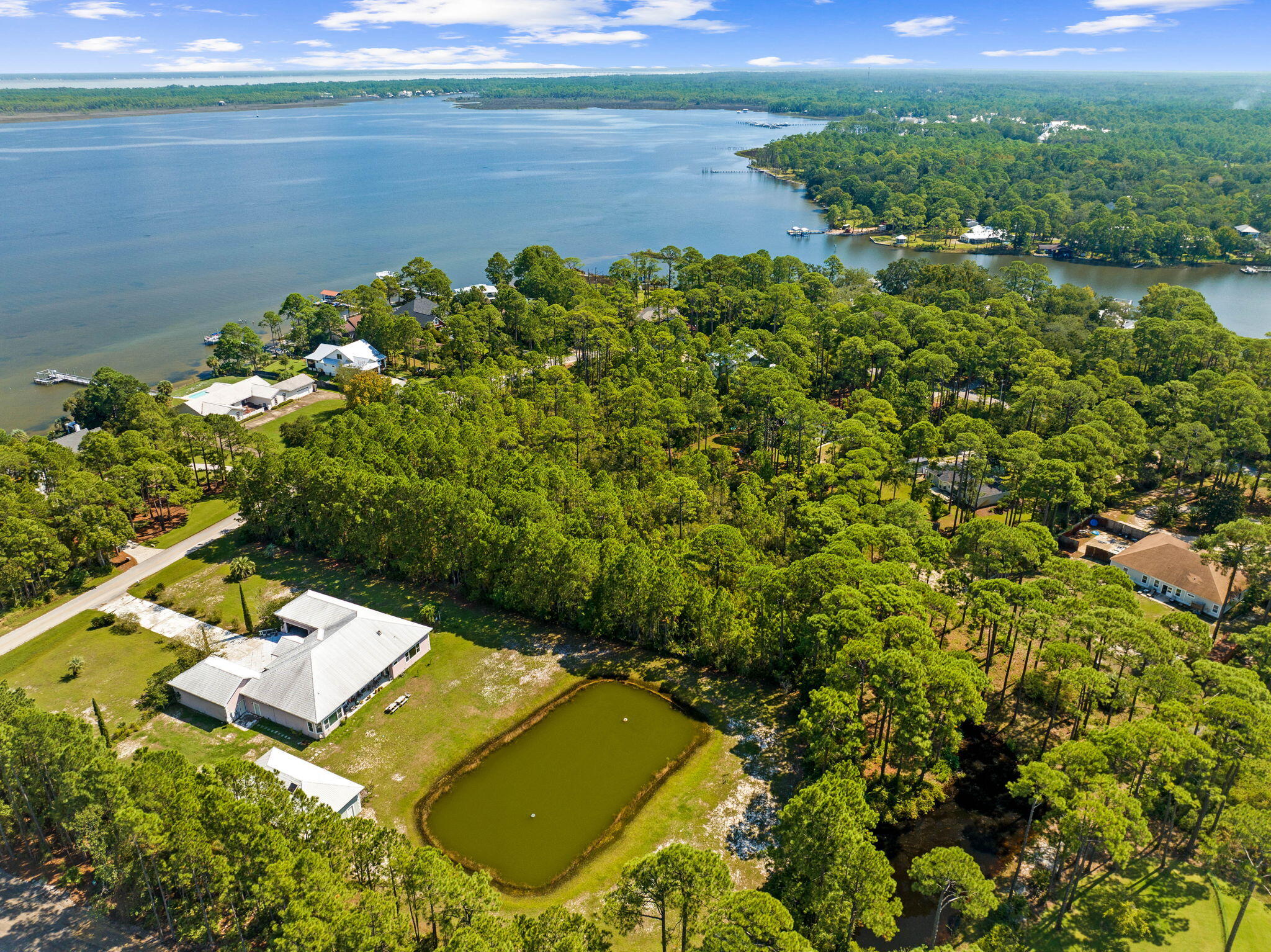 Lot 30 Woodland Bayou Drive Santa Rosa Beach, FL 32459 - Photo 21 of 28 a view of a lake with a house