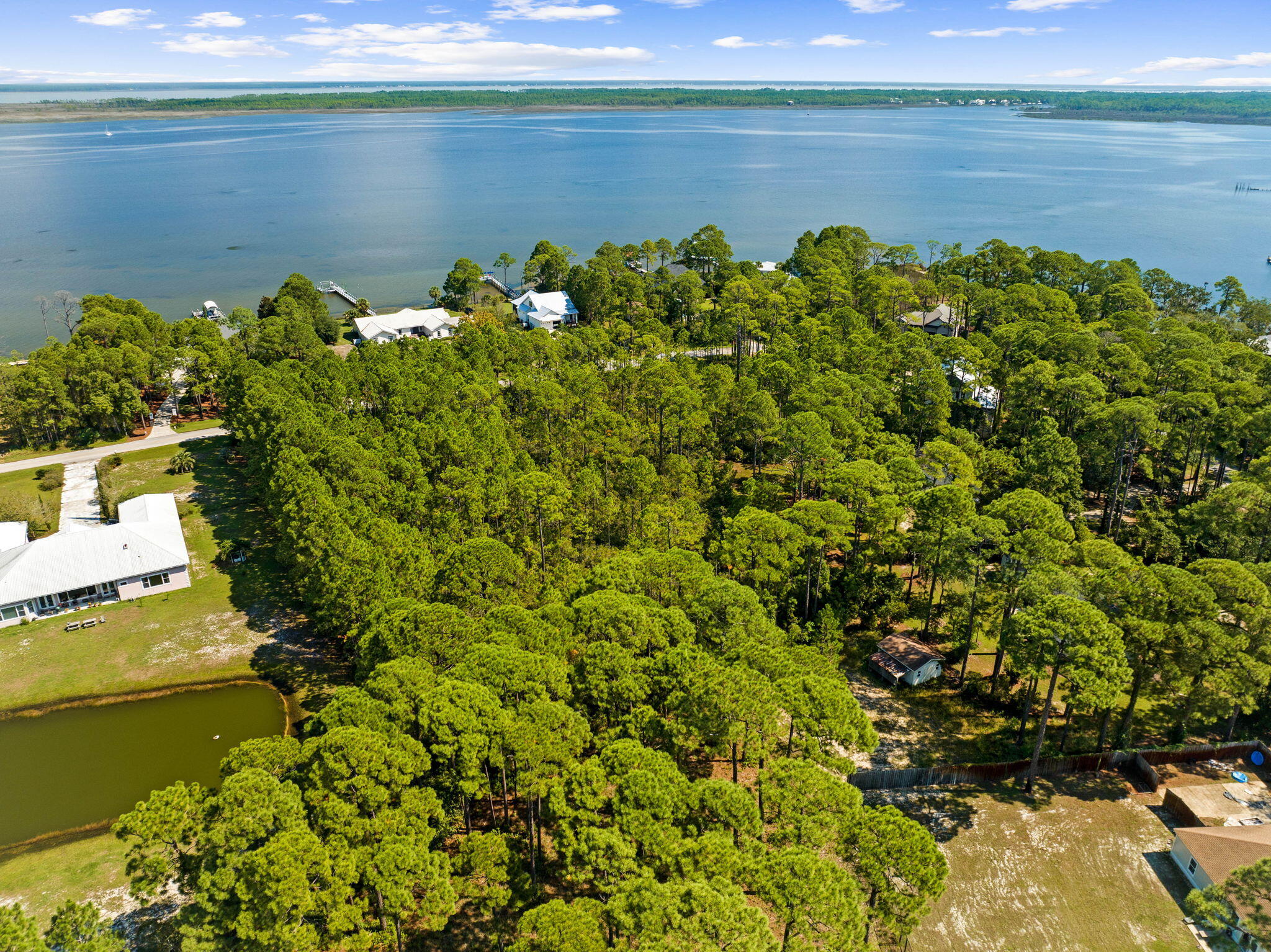 Lot 30 Woodland Bayou Drive Santa Rosa Beach, FL 32459 - Photo 23 of 28 a view of a lake with a yard