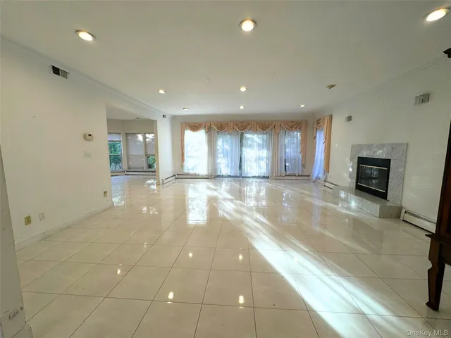 a view of a lobby with furniture and a kitchen