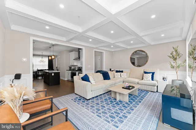 a living room with lots of furniture and a rug