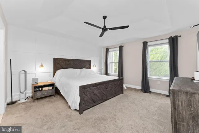 a bedroom with a bed closet and window