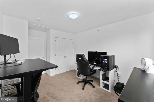 a view of a workspace with furniture