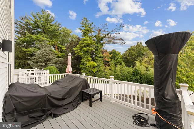 a view of a chair and table on the deck