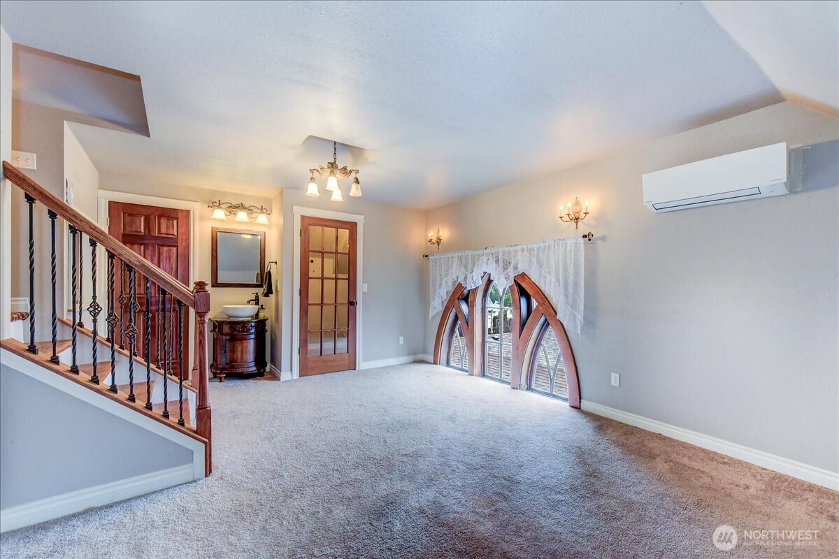 1313 Washington Street Sumner, WA 98390 - Photo 23 of 40 a view of a hallway with a lot of white walls