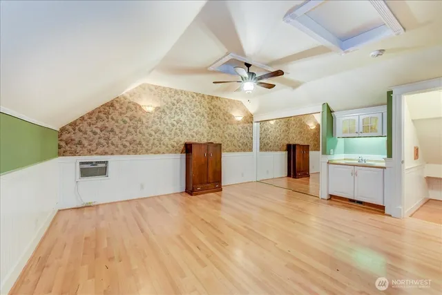 a kitchen with stainless steel appliances granite countertop a refrigerator a oven and wooden cabinets