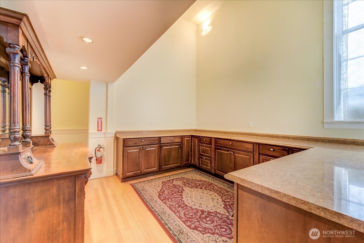 1313 Washington Street Sumner, WA 98390 - Photo 35 of 40 a view of a kitchen with a sink and cabinets