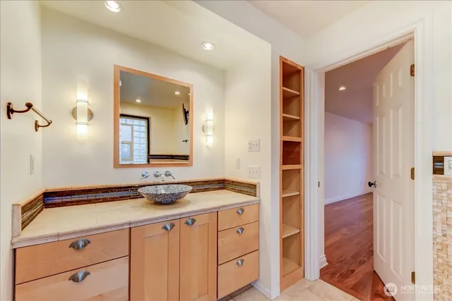 a bathroom with a sink and a mirror