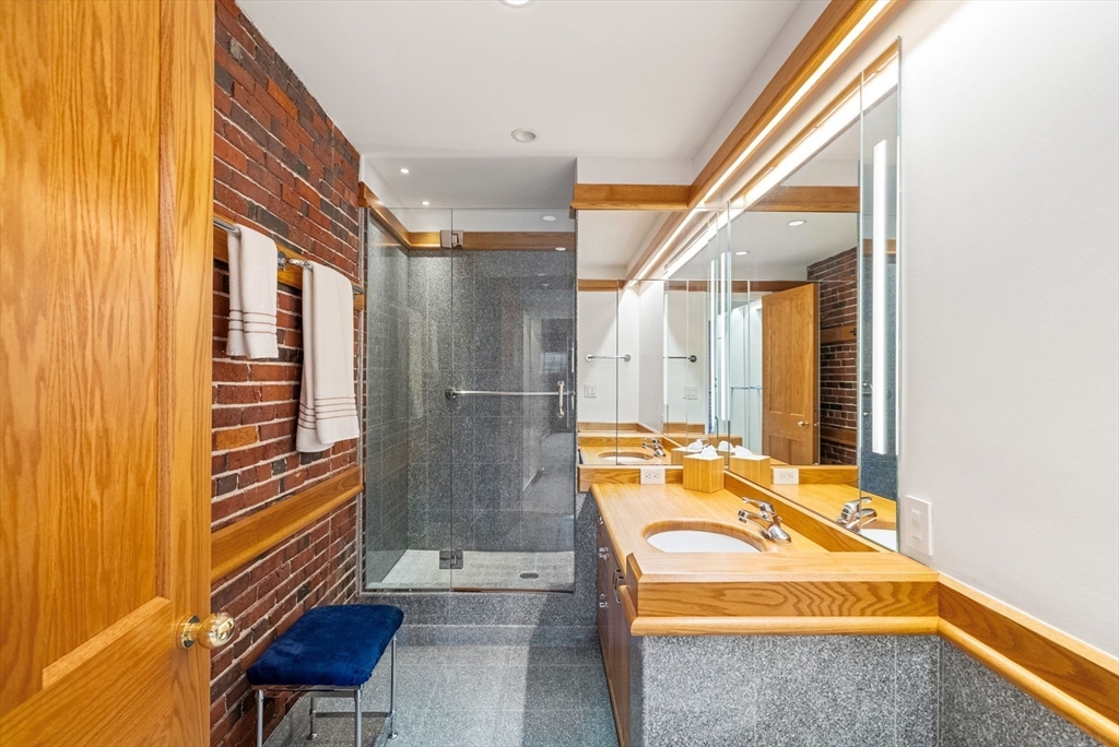 436 Lewis Wharf, Unit 436 Boston, MA 02110 - Photo 30 of 40 a bathroom with a tub and sink