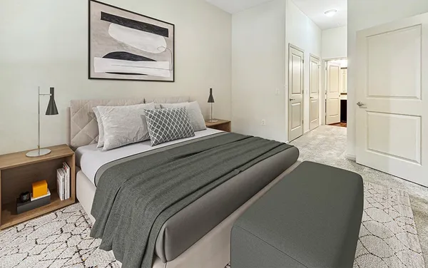 a bedroom with a bed and a fireplace