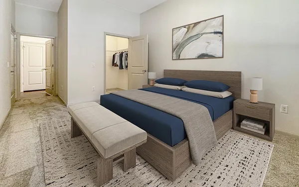 a bedroom with a bed and a table in it