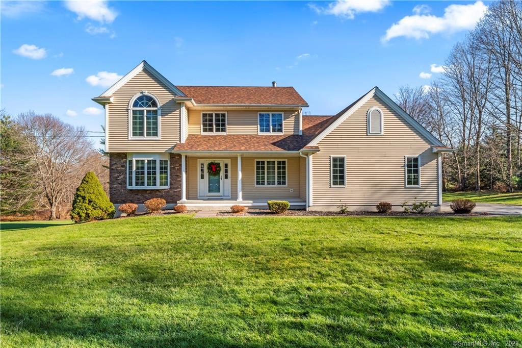 61 Obtuse Road South Brookfield, CT 06804 - Photo 1 of 1 a front view of a house with a garden and porch
