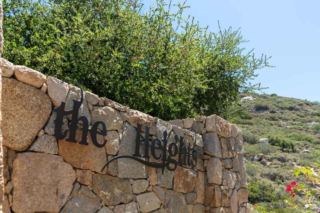 18055 Sunset Point Poway, CA 92064 - Photo 34 of 39 a sign that is on the side of a road