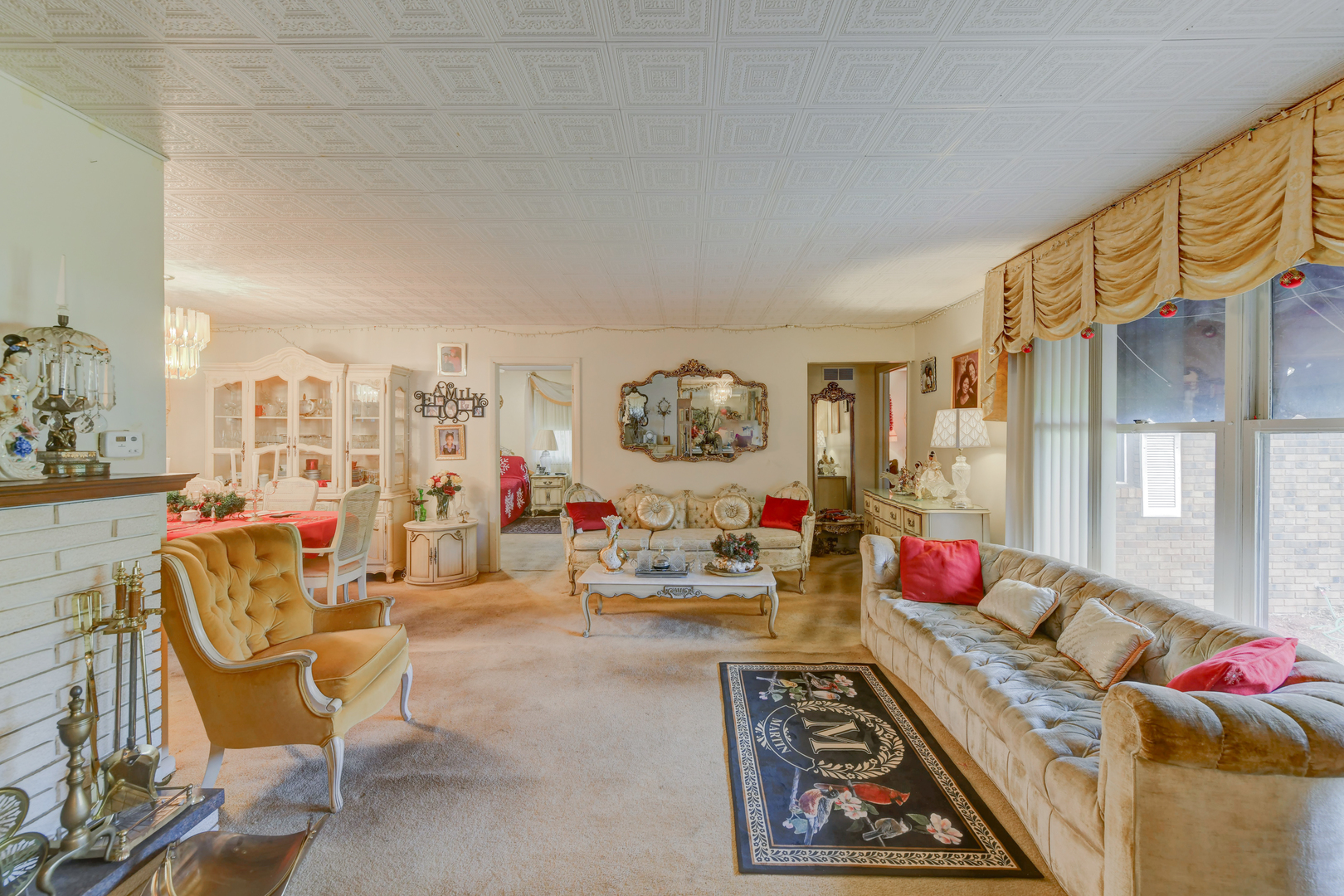 126 Denell Drive Crete, IL 60417 - Photo 10 of 30 a living room with furniture and a chandelier