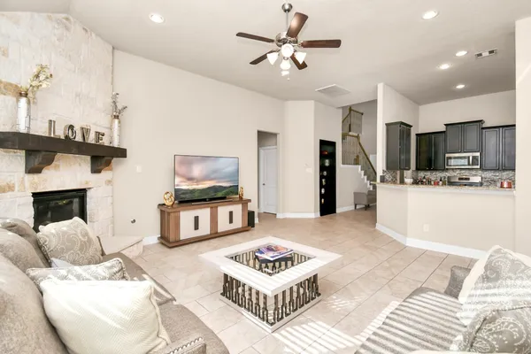 a living room with furniture and a flat screen tv