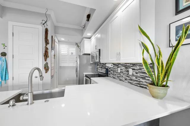 a bathroom with a double vanity sink mirror and bathtub
