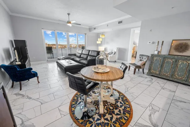 a living room with furniture and a large window