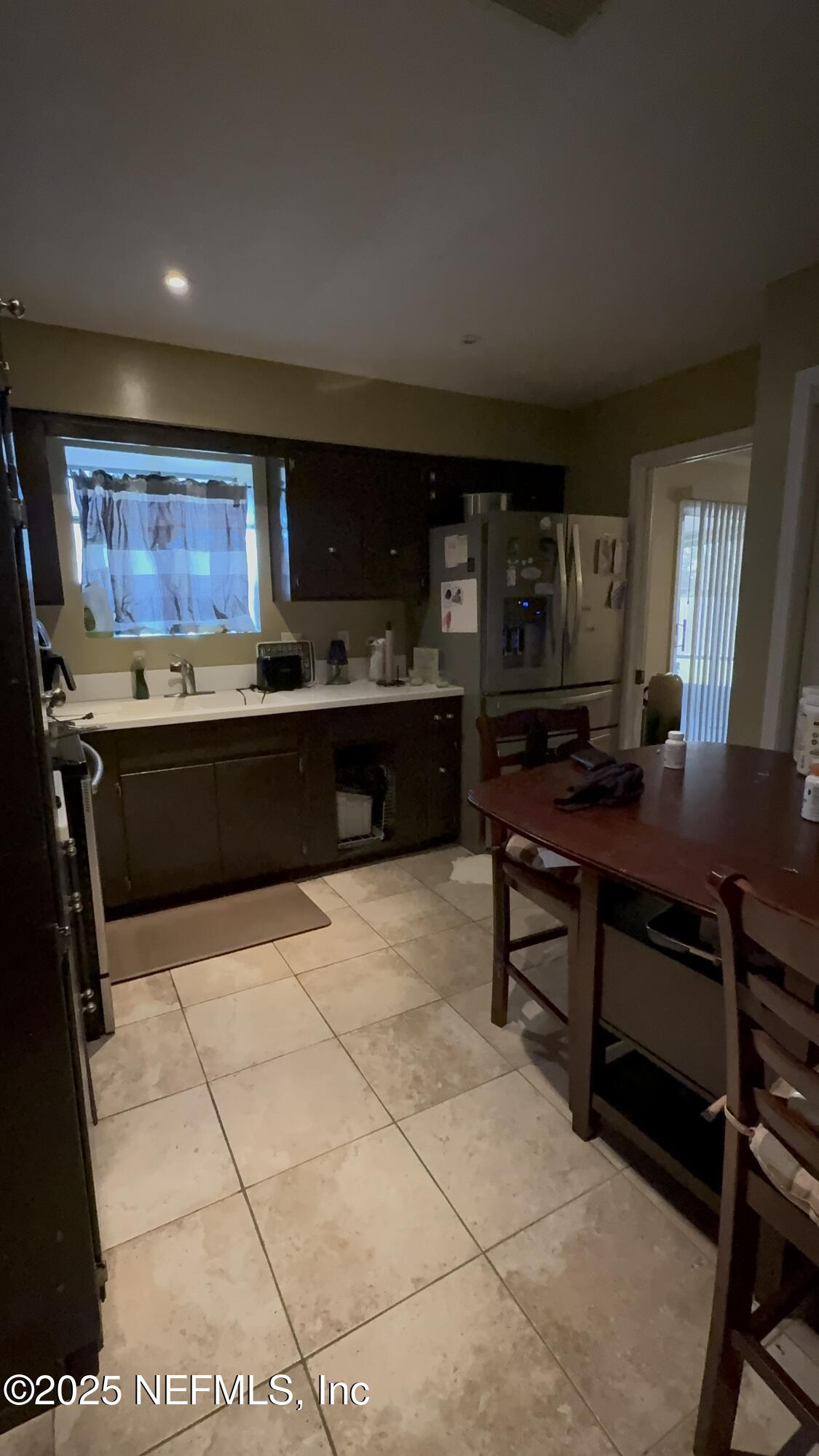 3976 Raintree Road Jacksonville, FL 32277 - Photo 4 of 13 KITCHEN-VIEW FROM DINING