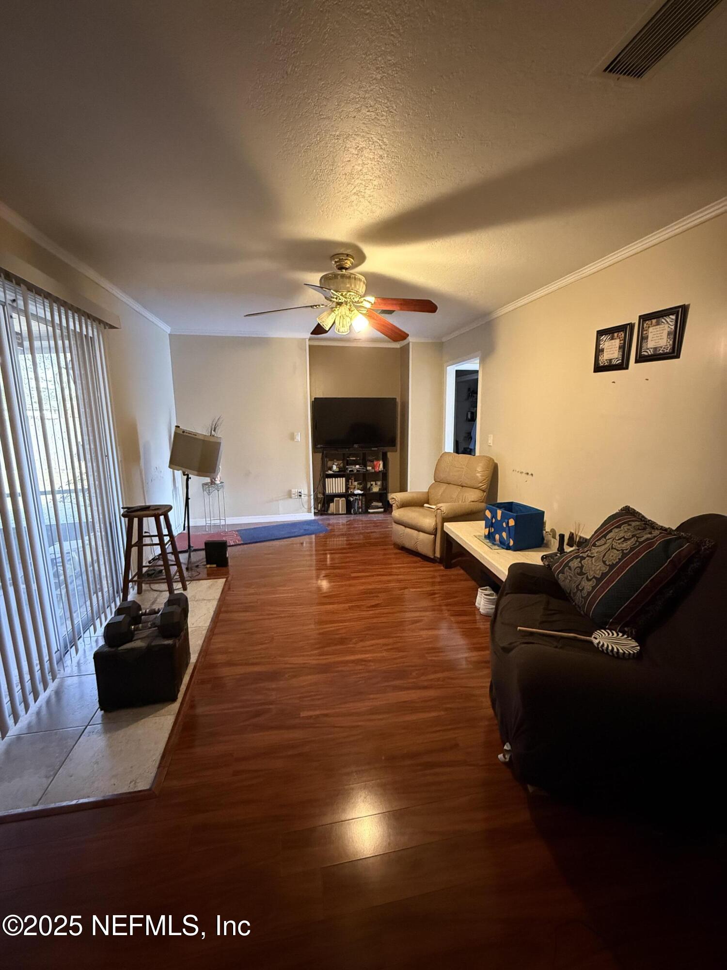 3976 Raintree Road Jacksonville, FL 32277 - Photo 7 of 13 FAMILY ROOM-VIEW FROM KITCHEN