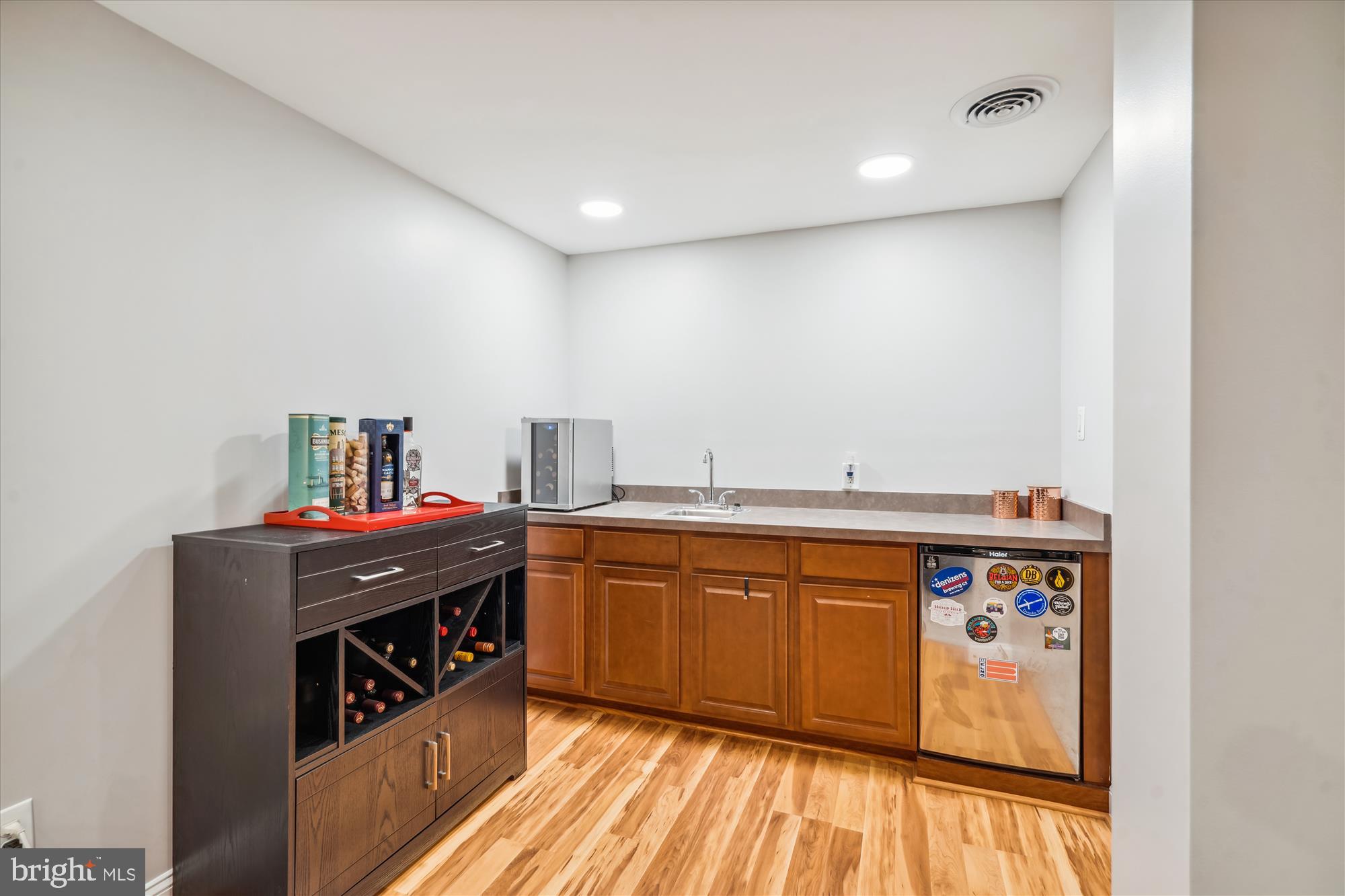 501 Apple Grove Road Silver Spring, MD 20904 - Photo 29 of 50 Basement wet bar with beverage fridge