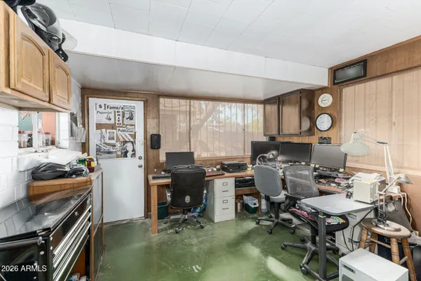 a workspace with furniture and a fireplace