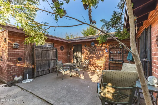 a outdoor living space with patio furniture and potted plants