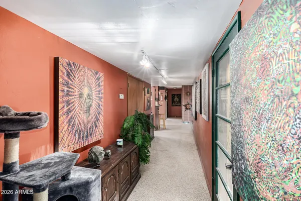 a lobby with furniture and wooden floor