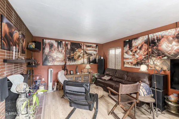 a living room with furniture and a floor to ceiling window