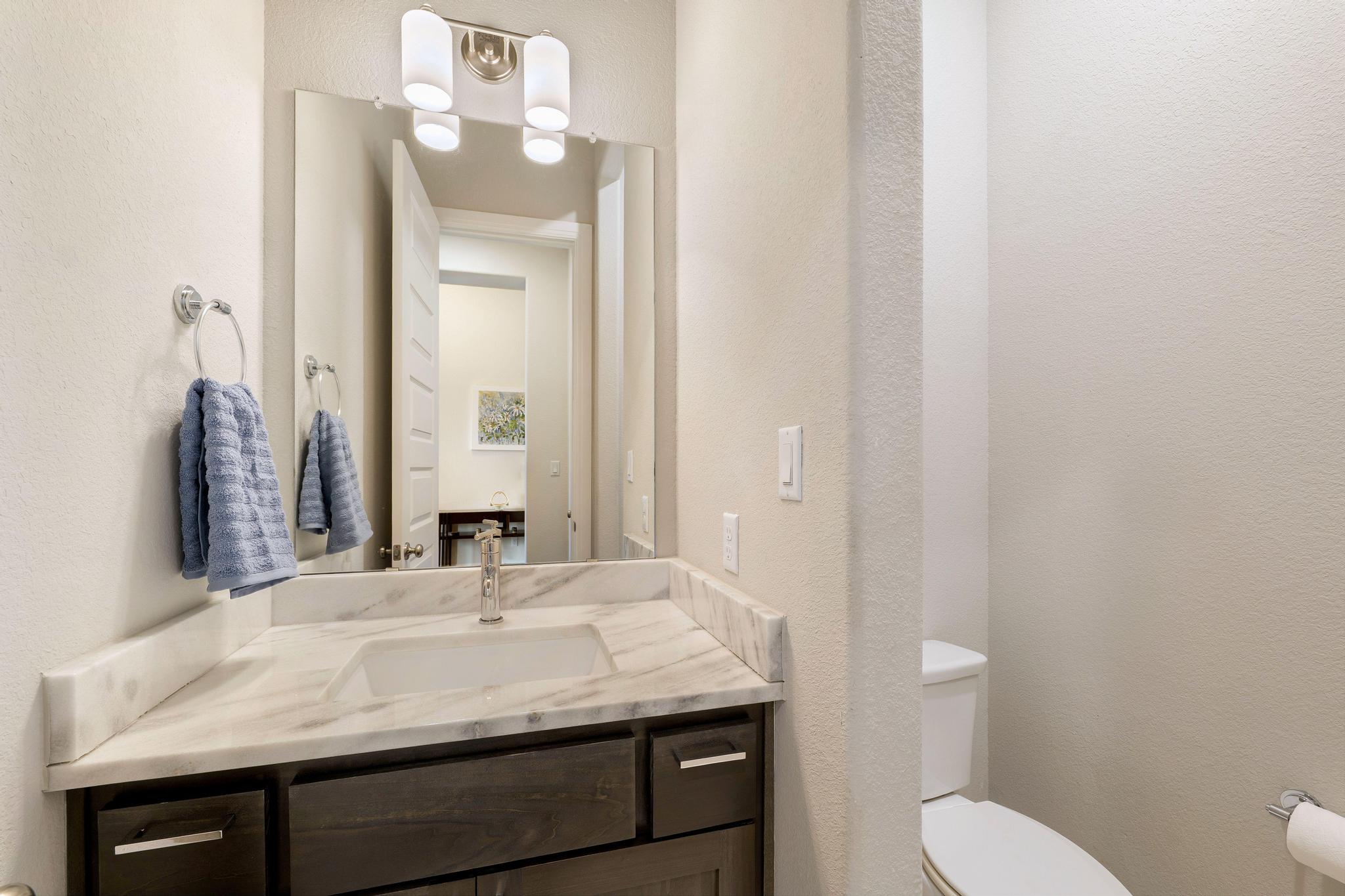 1009 Legacy Crossing Georgetown, TX 78628 - Photo 6 of 40 Marble vanity tops and ample storage distinguish this contemporary bathroom.