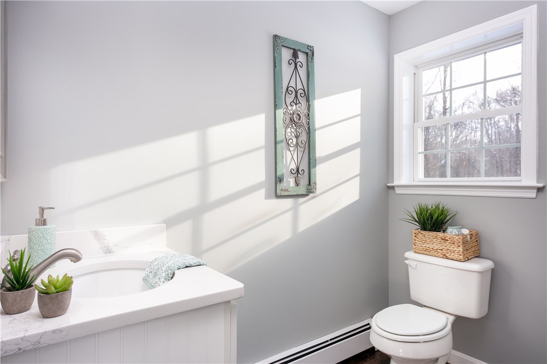 240 Bungy Road Scituate, RI 02857 - Photo 24 of 39 1st floor half bath, updated vanity, counter & lights