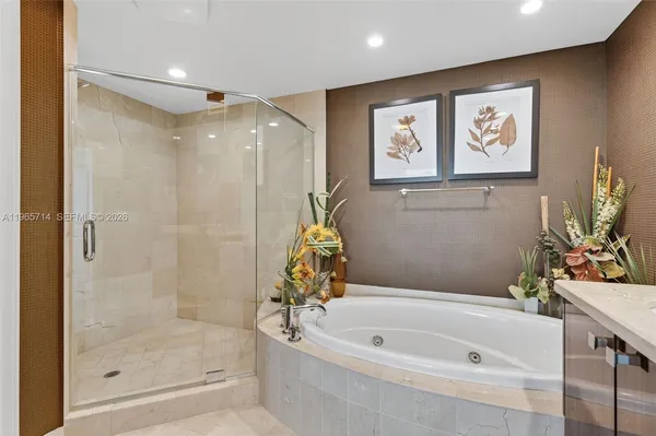 a bathroom with a toilet sink and shower