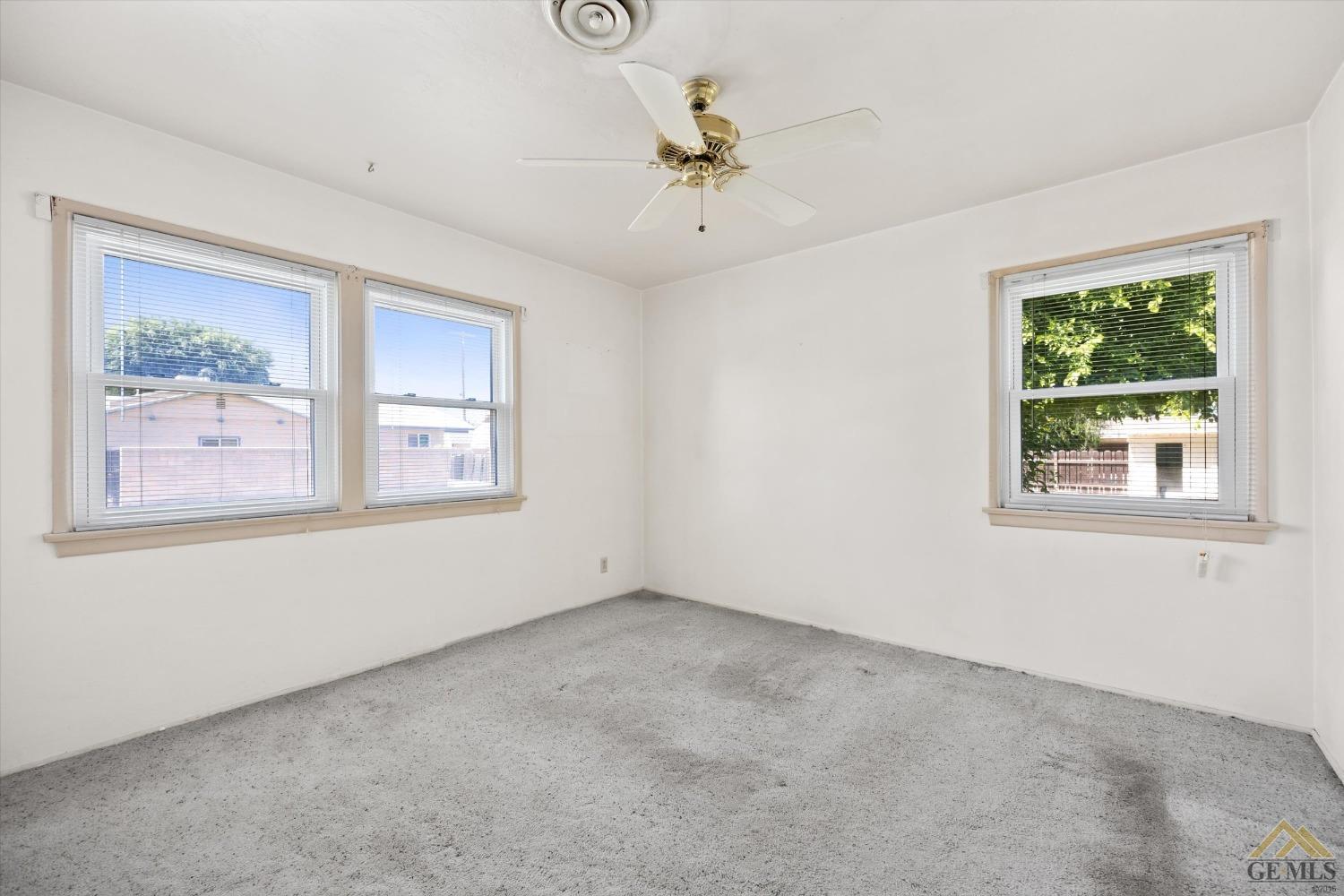 Undisclosed Address Wasco, CA 93280 - Photo 12 of 21 an empty room with a window