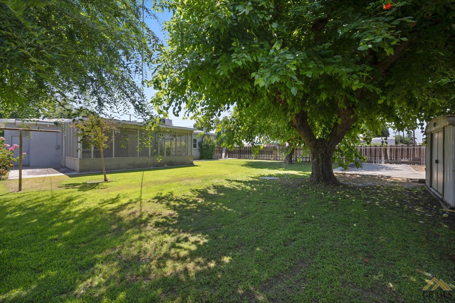 Undisclosed Address Wasco, CA 93280 - Photo 18 of 21 a view of a trees with a yard