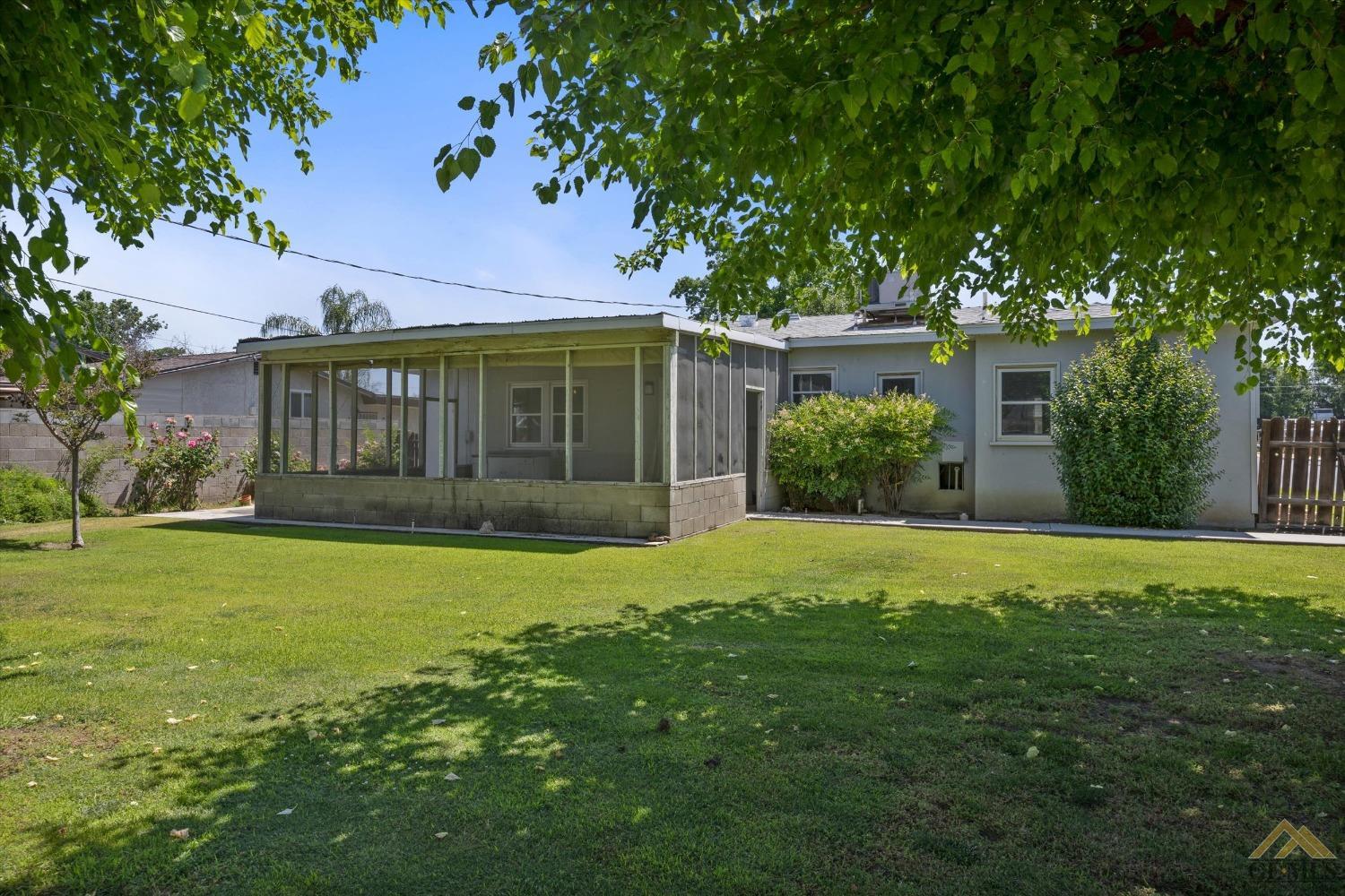 Undisclosed Address Wasco, CA 93280 - Photo 19 of 21 front view of a house with a yard