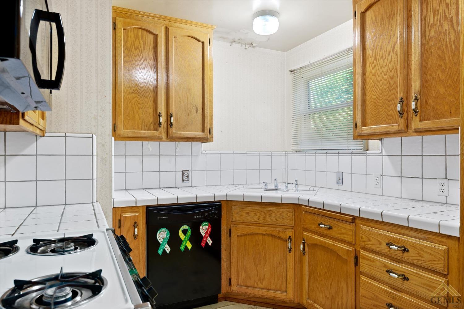 Undisclosed Address Wasco, CA 93280 - Photo 8 of 21 a bathroom with a sink a vanity and a mirror