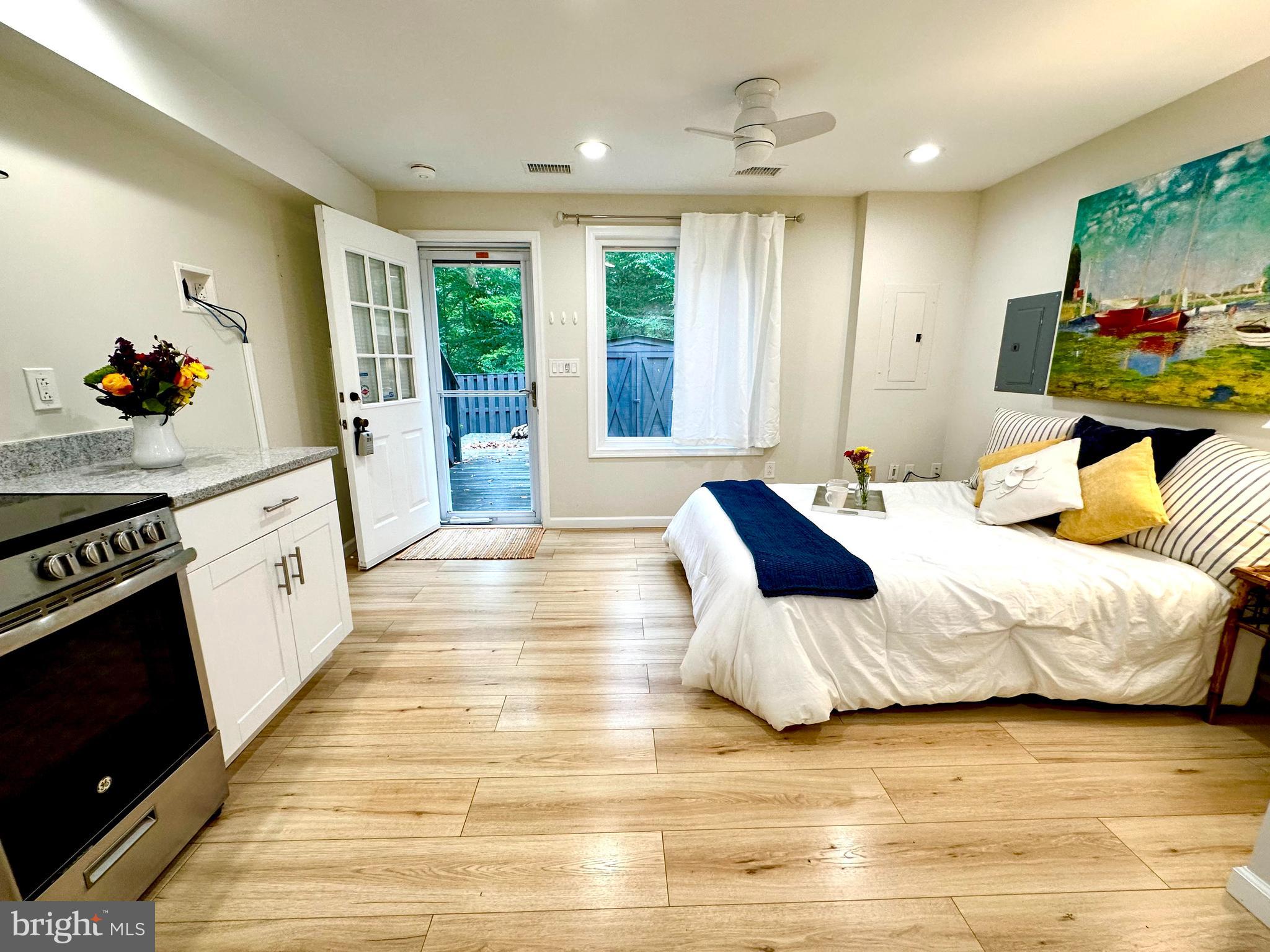 8301 Windfall Road Springfield, VA 22153 - Photo 5 of 22 a large bedroom with a bed and large windows